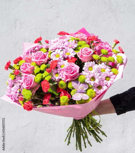 Wallpaper Mural Colorful flower bouqet arrangement. Summer flowers held by florist in hand close up. Flowers for wedding and happy occasions. Torontodigital.ca