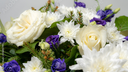 Colorful wreath flower arrangement. Floral concept isolated on white background. Funeral flowers.