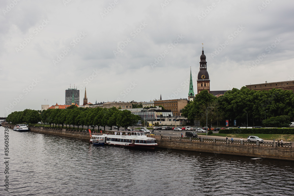 Riga, Latvia - 11-06-2019: Riga old town river bank on a cloudy day, Latvia