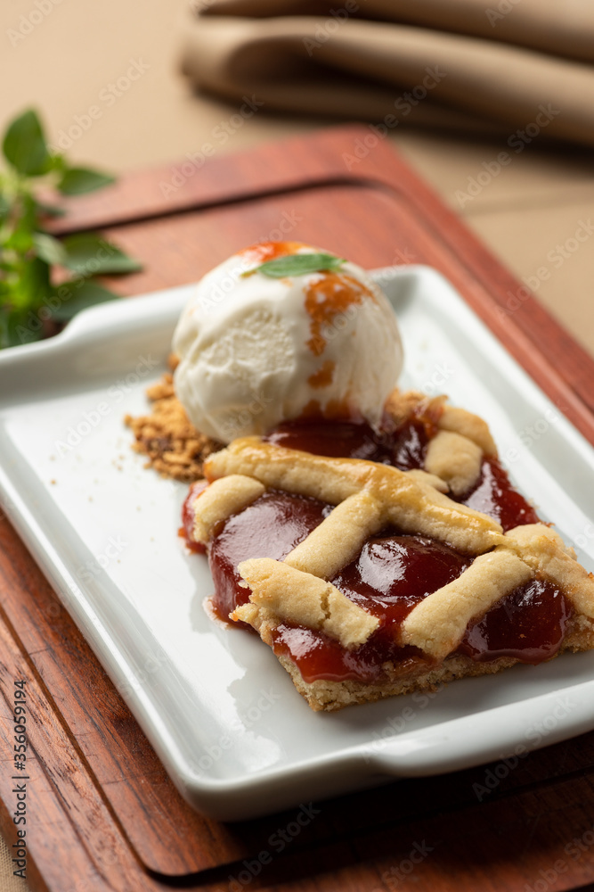 guava pie with vanilla ice cream on white plate guava pie with vanilla ice cream on white plate