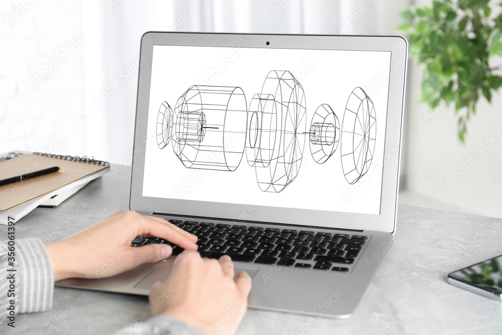 Female engineer working with 3d model of modern equipment on laptop indoors, closeup Female engineer working with 3d model of modern equipment on laptop indoors, closeup