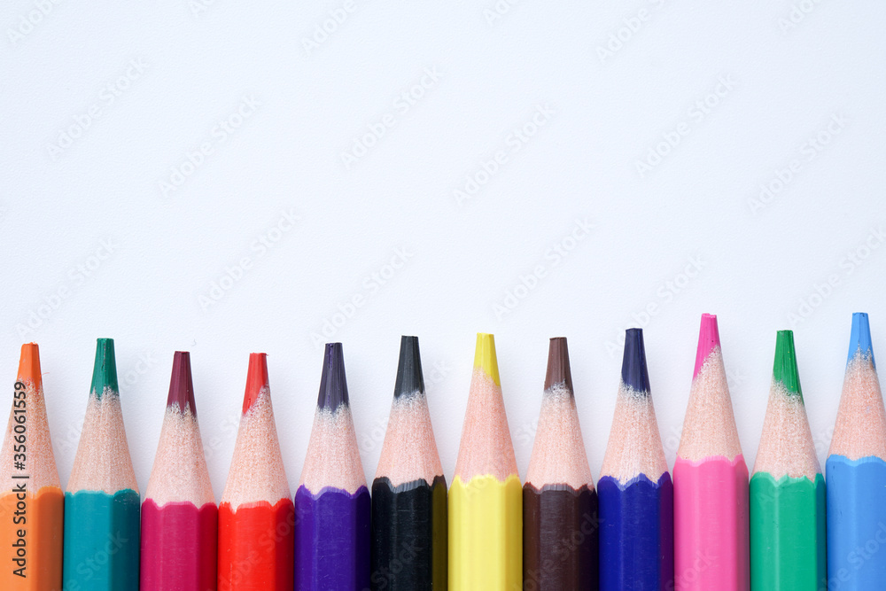 Close up color pencils isolated on white background space for text.
Close up color pencils isolated on white background space for text.