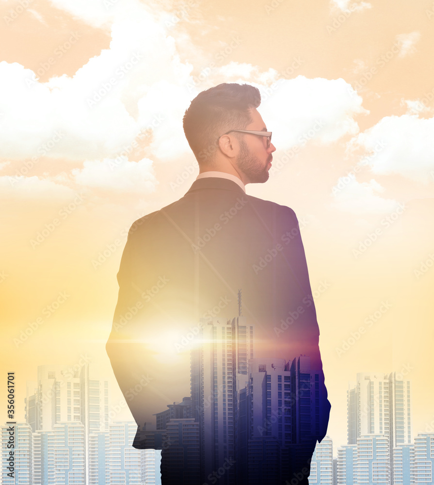 Double exposure of businessman and cityscape on sunset Double exposure of businessman and cityscape on sunset