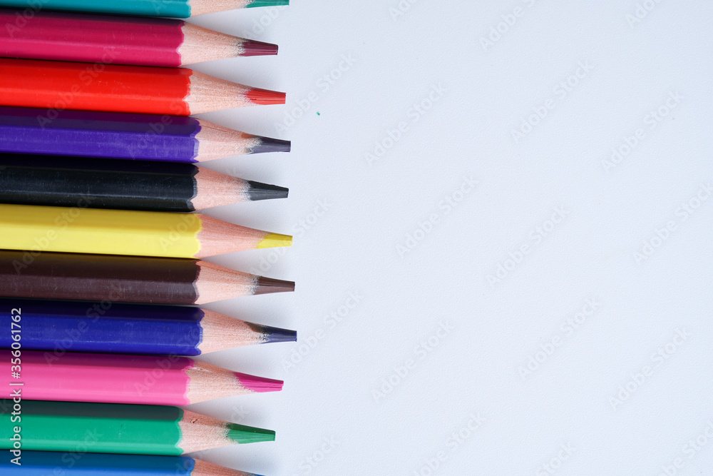 Close up color pencils isolated on white background space for text.
Close up color pencils isolated on white background space for text.