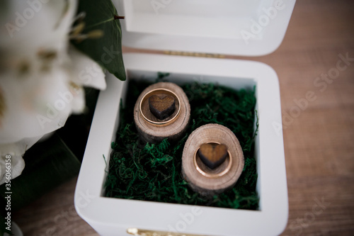 wedding gold rings in a wooden box