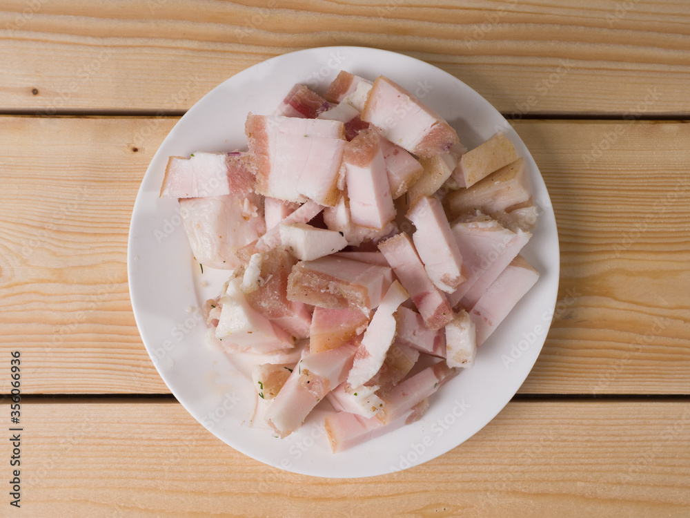 Fat sliced on a white plate. Russian appetizer Fat sliced on a white plate. Russian appetizer