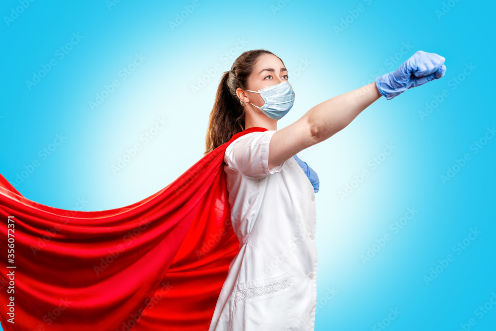 A doctor or nurse in medical gloves, a surgical mask and a red ...