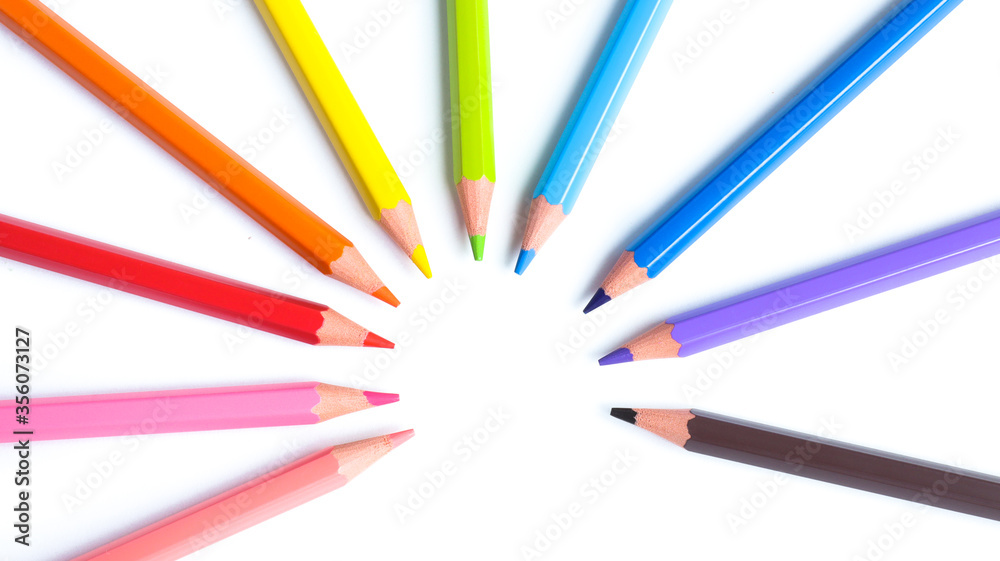 Group of colored pencils close-up isolated on a white background, flat lay