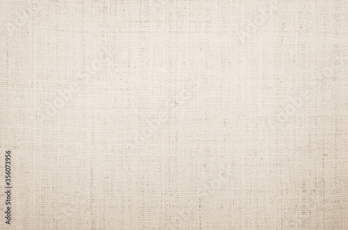 Cream natural linen fabric texture background. Beige cotton cloth wall