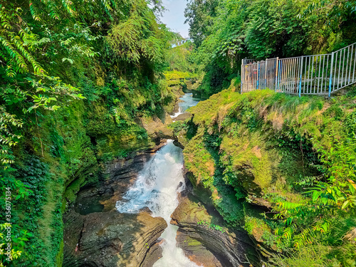 Wallpaper Mural Underground Waterfall in Pokhara, Nepal. David's Fall, Devi's Fall or Patale Chango passes though the cave beneath the ground. Torontodigital.ca