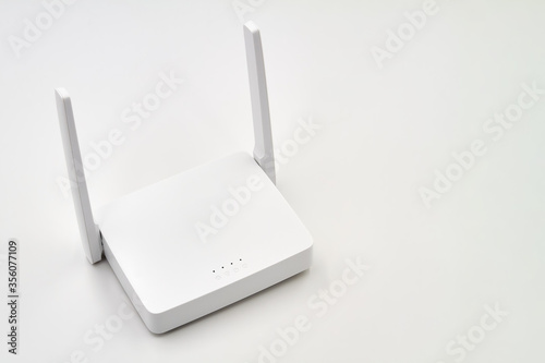 White wireless router on light background. Close-up