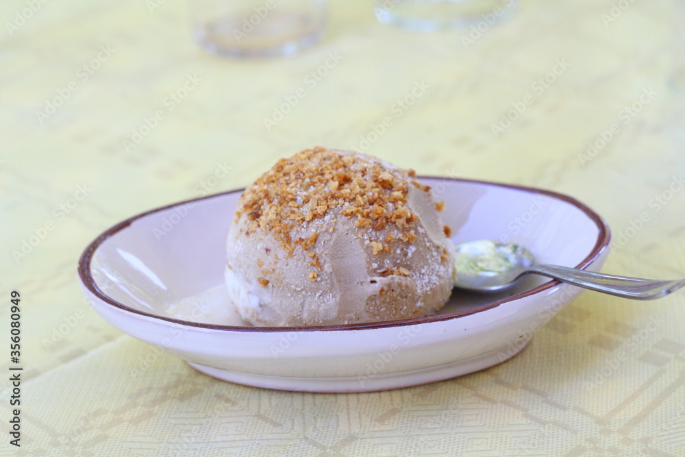 Tartufo - traditional ice cream with liquid filling in local restaurant, South Italy, Calabria Tartufo - traditional ice cream with liquid filling in local restaurant, South Italy, Calabria