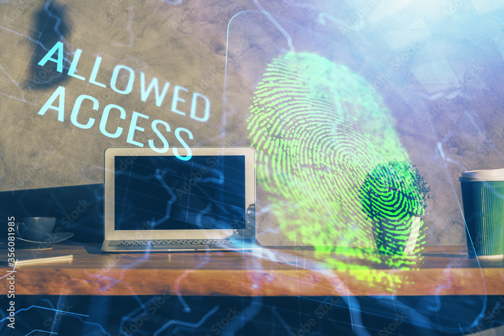 Computer on desktop in office with finger print drawing. Double exposure. Concept of business data security. Computer on desktop in office with finger print drawing. Double exposure. Concept of business data security.