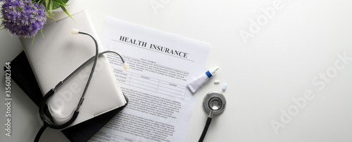 Obraz na plátně Life planning concept with health insurance form, stethoscope, schedule books an