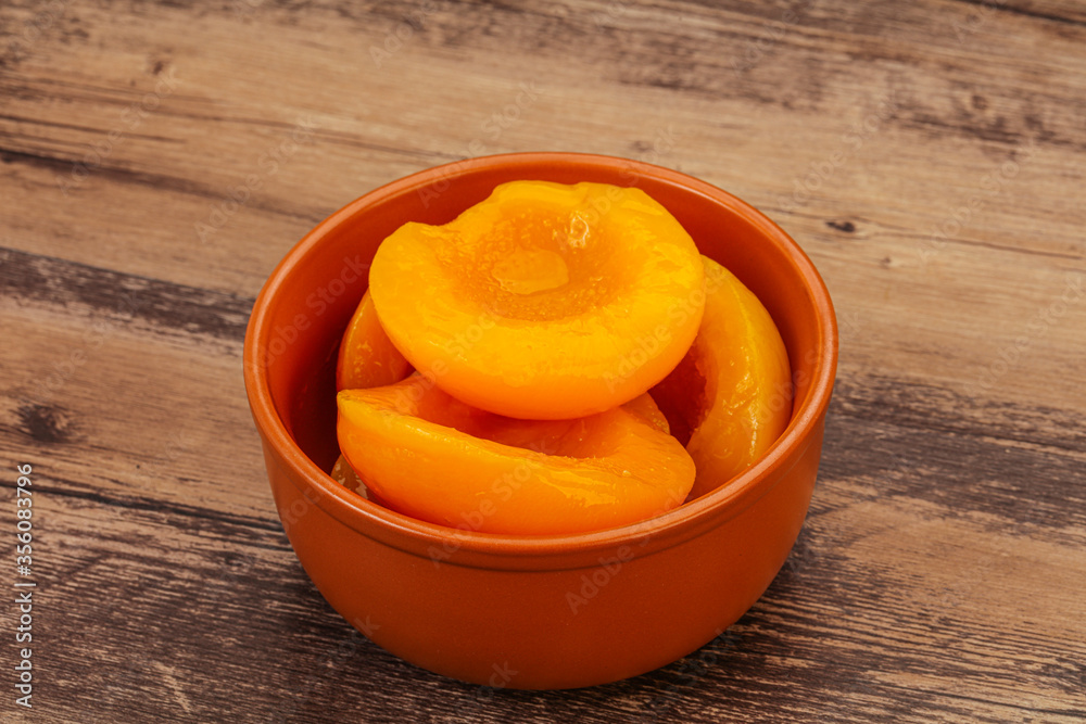 Marinated peaches fruit in the bowl Marinated peaches fruit in the bowl