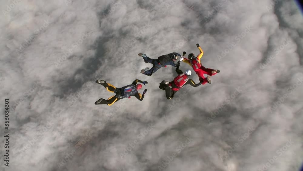 Sports parachutist build a figure in free fall. Extreme sport concept. Sports parachutist build a figure in free fall. Extreme sport concept.