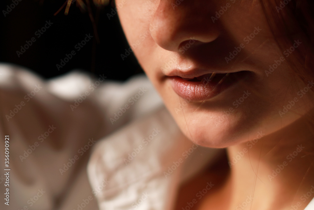 Close up head shot of beautiful girls lips with isolated on black background. Close up head shot of beautiful girls lips with isolated on black background.