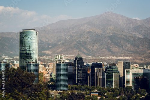 Skyline of modern buildings at financial district with The Andes mountain range in the back. photo