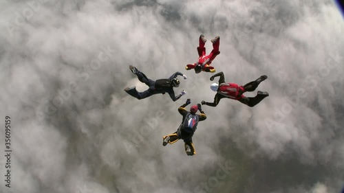 Sports parachutist build a figure in free fall. Extreme sport concept.