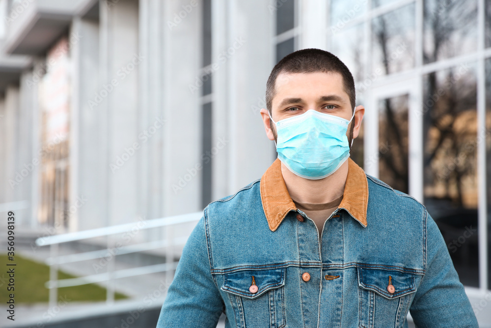 Man wearing disposable mask outdoors. Dangerous virus Man wearing disposable mask outdoors. Dangerous virus