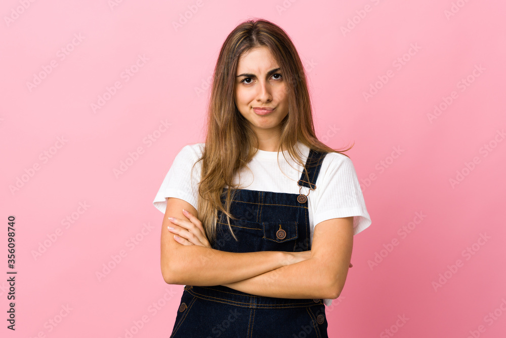 Young woman over isolated pink background with unhappy expression Young woman over isolated pink background with unhappy expression