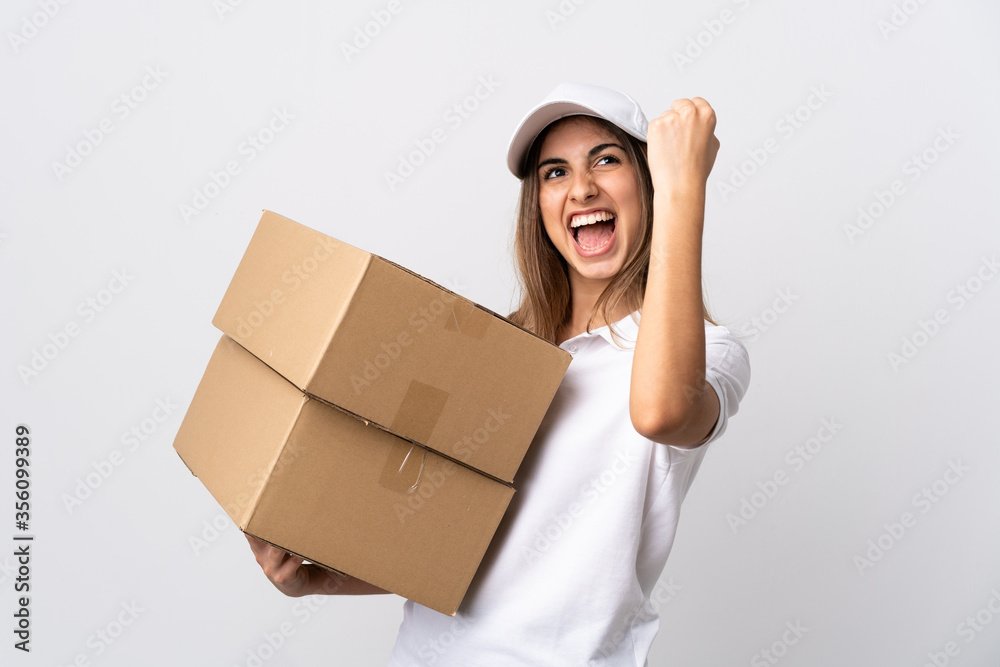Young delivery woman over isolated white background celebrating a victory Young delivery woman over isolated white background celebrating a victory