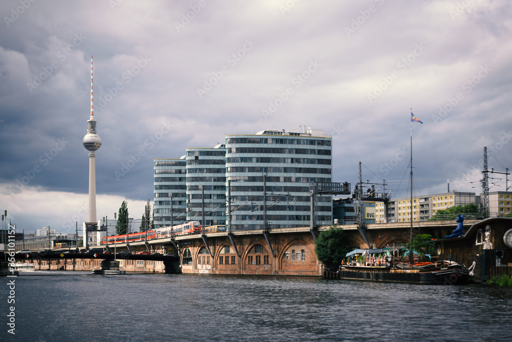 Modern architecture in Berlin on the banks of the river Spree with television tower in the background