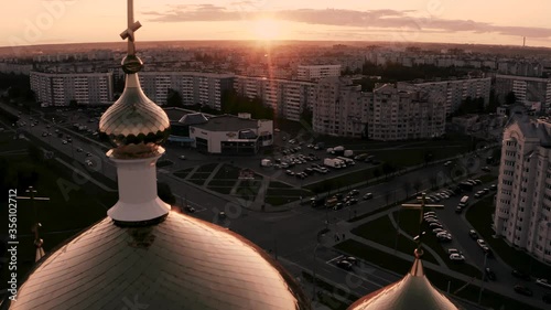 Golden domes of the Church at sunset photo