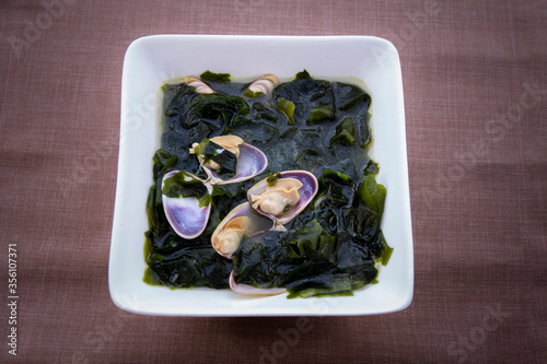 Fresh Seaweed Soup with clam with shell, Miyeok-guk photo