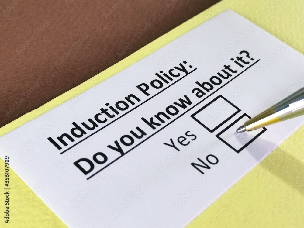 One person is answering question about induction policy. One person is answering question about induction policy.