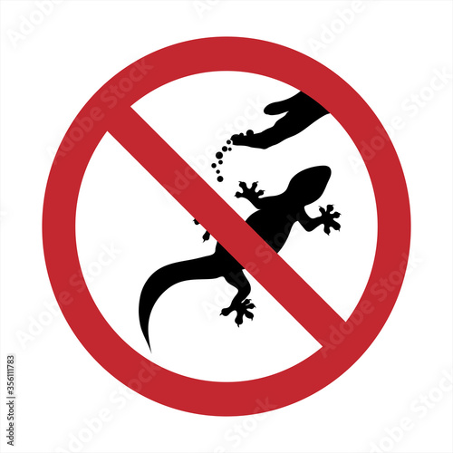Vector silhouette of do not feeding lizard mark on white background. Symbol of prohibition.