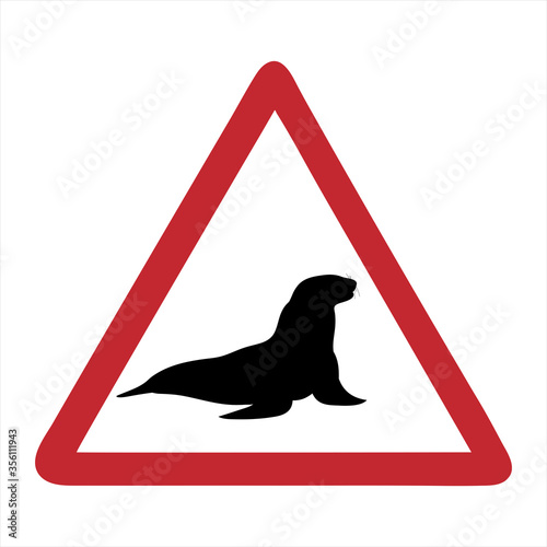 Vector silhouette of attention mark with sea lion on white background. Symbol of danger.