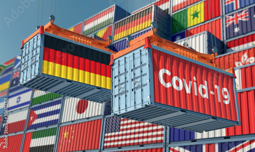 Container with Coronavirus Covid-19 text on the side and container with German Flag. Concept of international trade spreading the Corona virus. 3D Rendering © Marius Faust