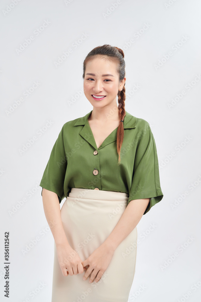 Portrait of young Asian business woman standing isolated over white background. Portrait of young Asian business woman standing isolated over white background.