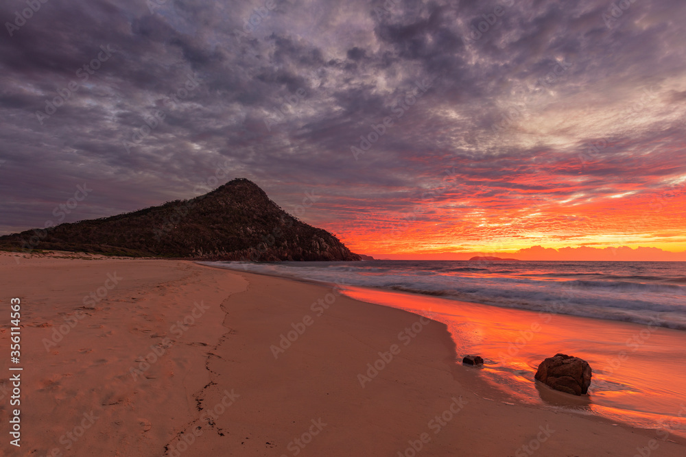 Colourful winter's sunrise over Tomaree  Headland and Zenith Beach.Shoal Bay ,Port Stephens,Tomaree National Park.East coast of N.S.W. Australia.