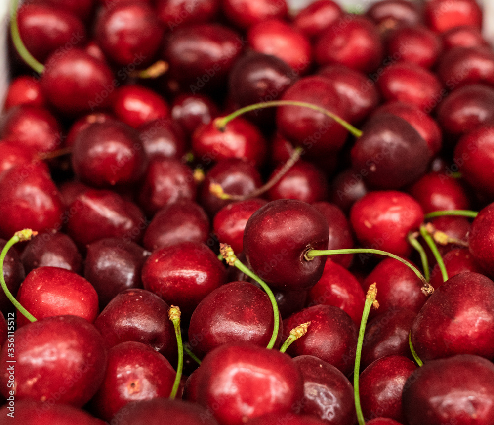ripe cherries lies in a box in beautiful flat rows. Plenty of delicious juicy berries. High quality photo ripe cherries lies in a box in beautiful flat rows. Plenty of delicious juicy berries. High quality photo