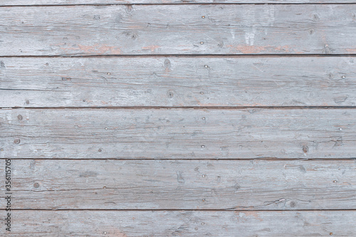 Background - wooden rough boards with peeling gray-blue paint