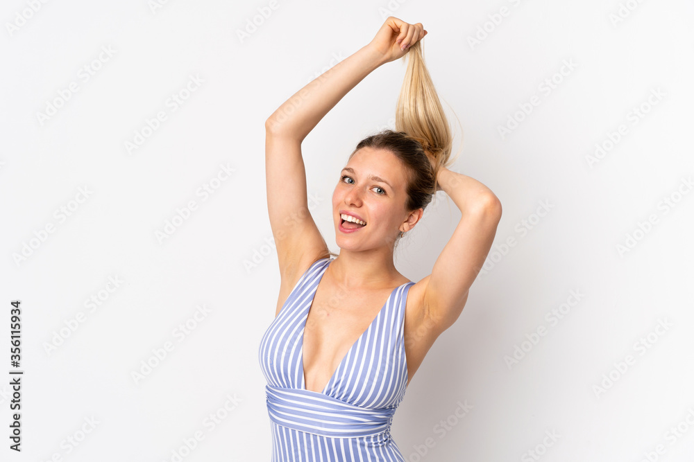 Young blonde woman isolated on white background in swimsuit in summer holidays Young blonde woman isolated on white background in swimsuit in summer holidays