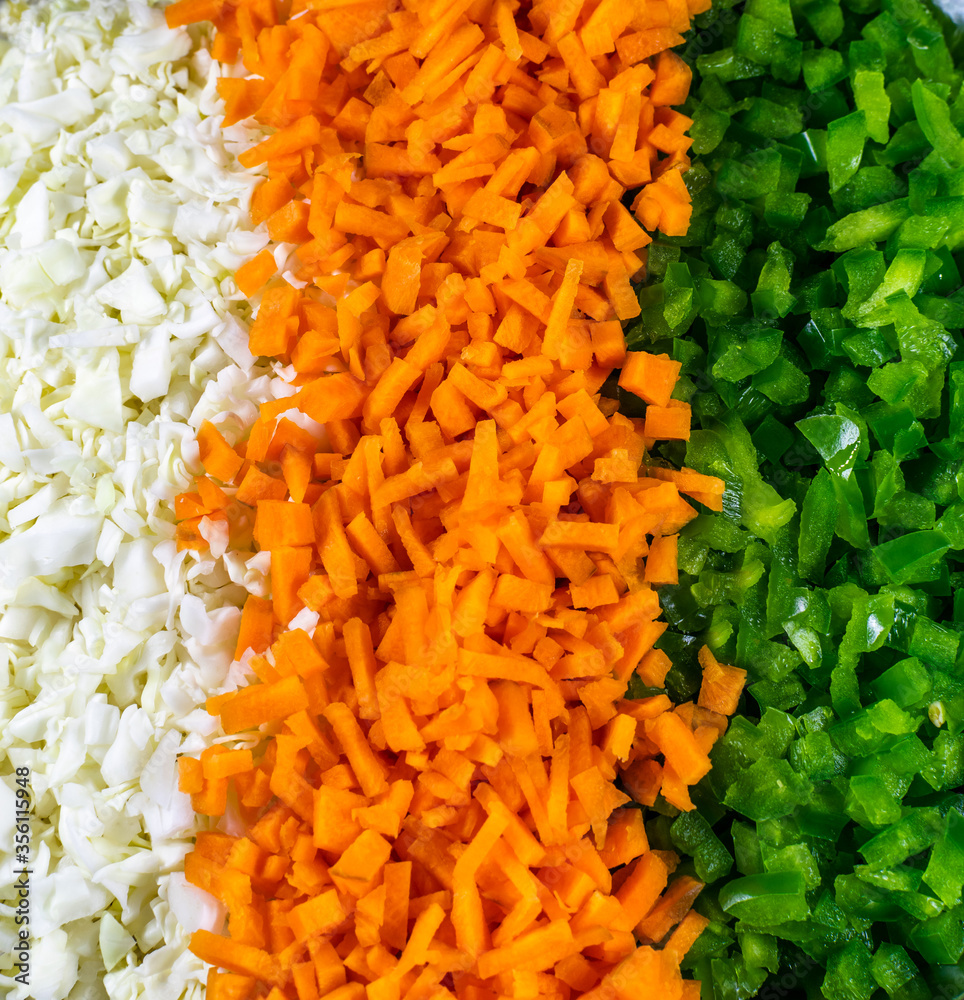chopped cabbage, carrot and green capsicum nicely arranged in plate chopped cabbage, carrot and green capsicum nicely arranged in plate