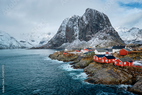 Hamnoy fishing village with red rorbu houses in Norwegian fjord in winter. Lofoten Islands, Norway