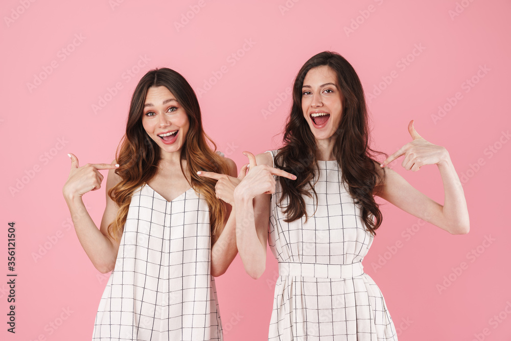 Image of cheerful nice women smiling and pointing fingers at herself Image of cheerful nice women smiling and pointing fingers at herself