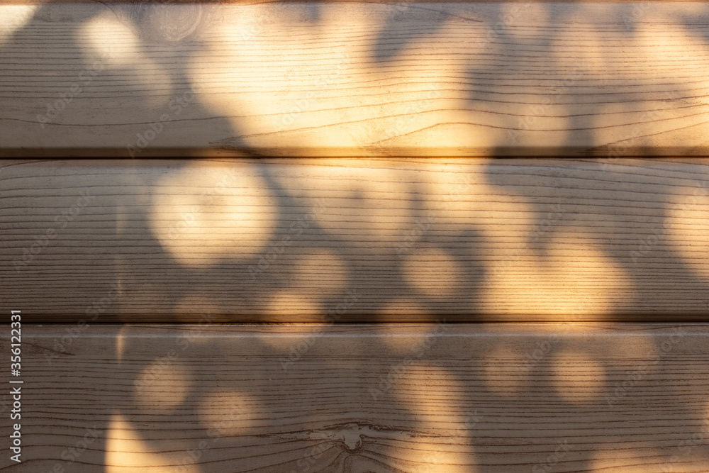 Tree shadow background and natural leaves on branch and tree trunk pattern on wooden boards, nature, shadows pattern on wall