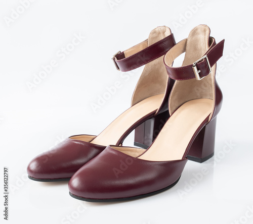 Womens leather cherry shoes on a white background