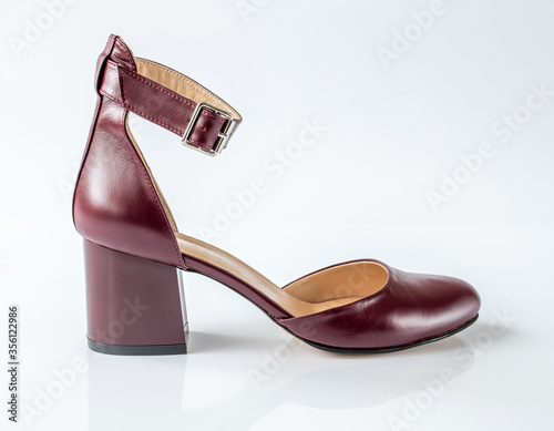 Womens leather cherry shoes on a white background photo