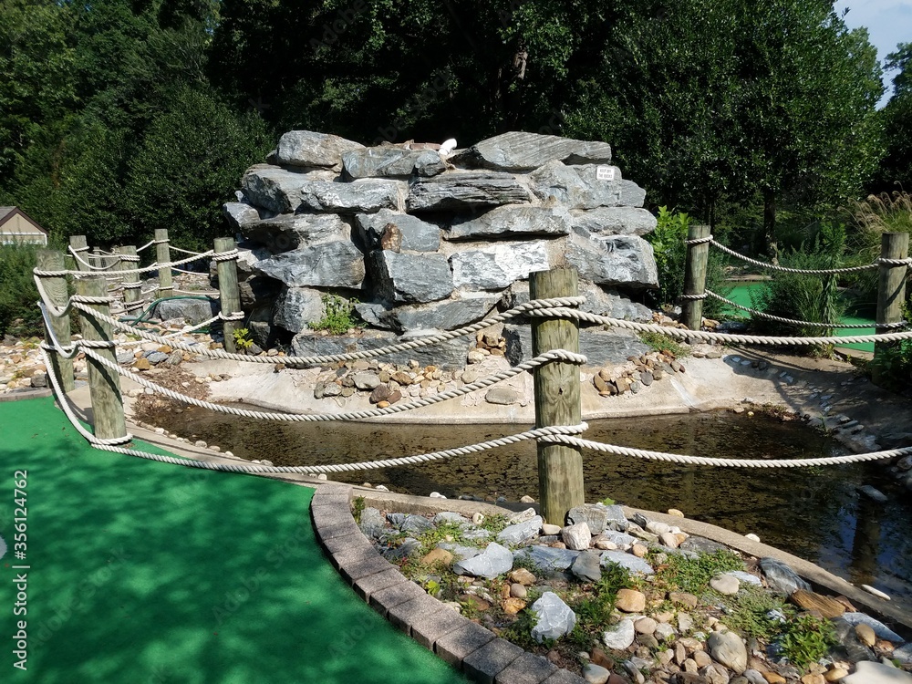 rocks and water and algae at miniature golf course