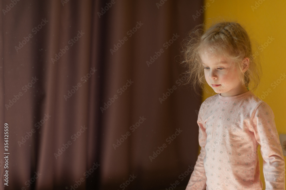 Portrait of a little girl at home. Disheveled little girl at home. Portrait of a little girl at home. Disheveled little girl at home.