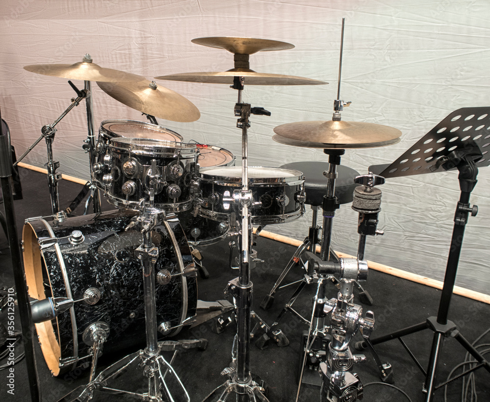 Drum Set with some cymbals on stage before a live Concert.