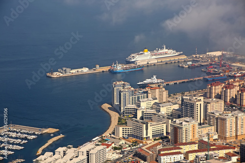 View from the Rock of the city below, the commercial port & also cruise ships in port, Gibraltar.