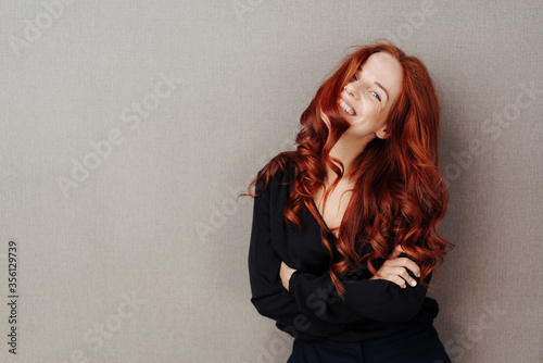 Beautiful sexy young woman with long red hair photo