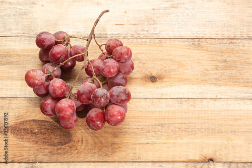 Tasty grapes on a wooden table. Healthy food